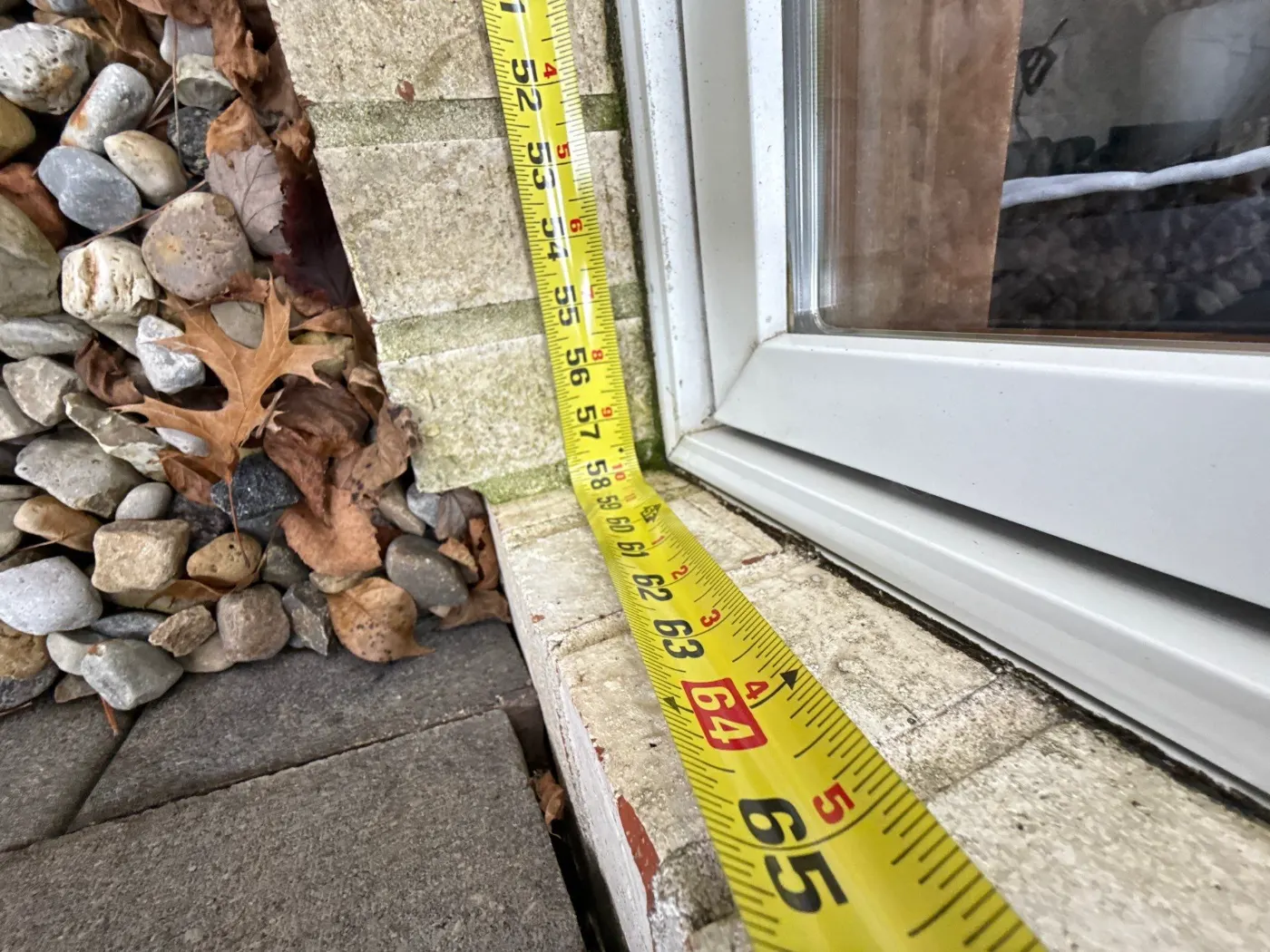 Storm-damaged window documented in Eagle Village